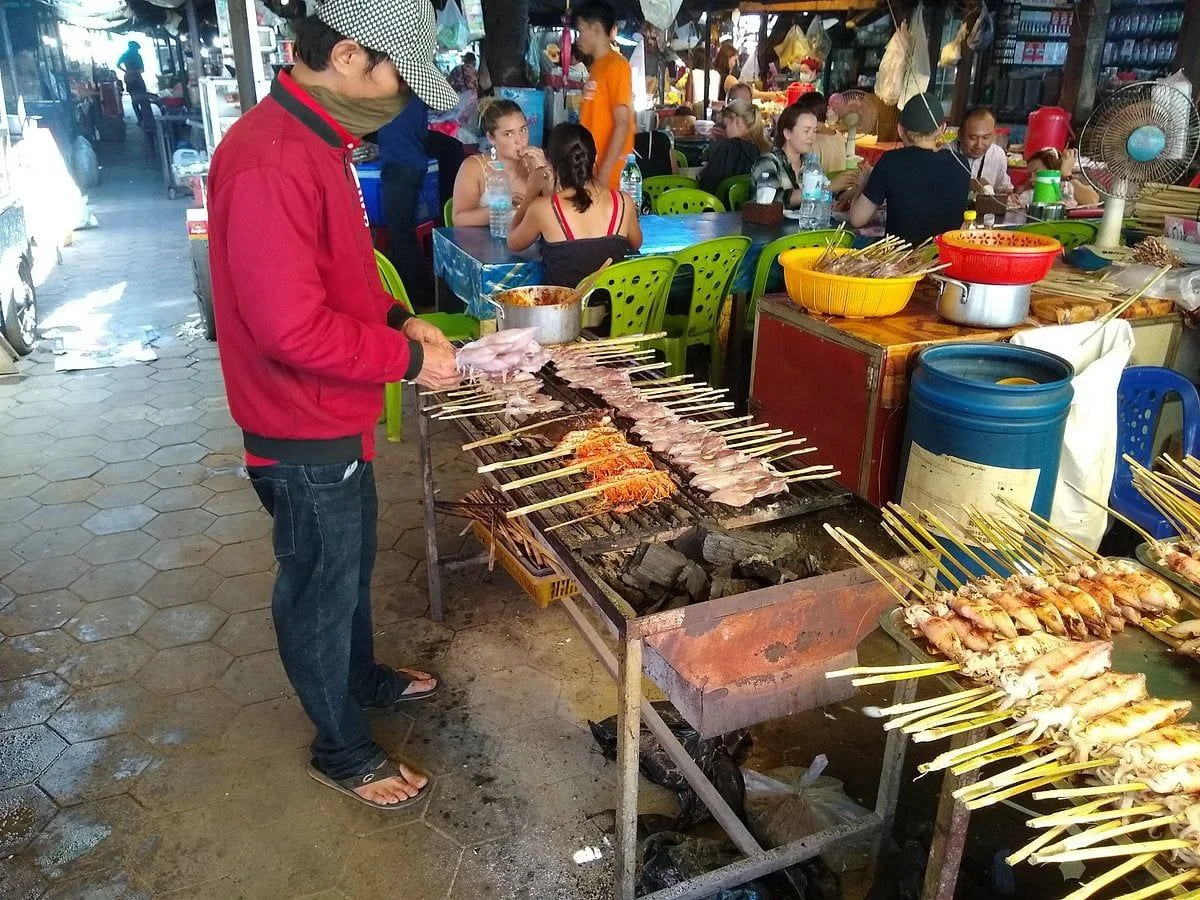 Bustling local Khmer market with fruits